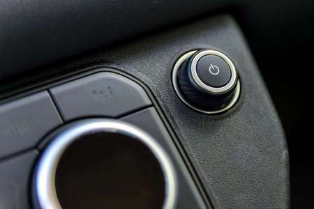 Car volume regulator and on and off button. luxury modern car interiorの写真素材