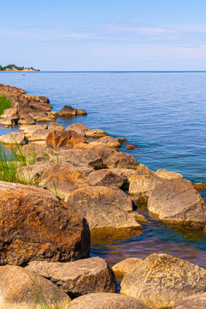 Coast of Finland bay with boulders and stones. Shelf of the Baltic sea, gulf of Finland.の写真素材