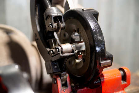 Close up view of pipe cutter. Hi-technology parts manufacturing process by turning machine.の写真素材