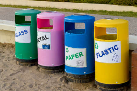 Garbage in colored trash cans with sorted garbage icons. plastic, paper, metal, glass. Sorting garbage by material and type. environmental protection, ecology.の写真素材