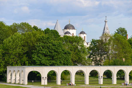 Russia, Velikiy Novgorod, 2021, June 03: Yaroslav's Court with the old cathedral of St. Nicholas and the arcade of Gostiny Dvor. Novgorod Veliky, Russia.のeditorial素材