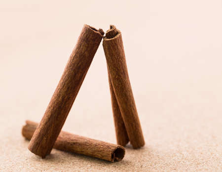 Cinnamon sticks on corkwood background. Space for text.の写真素材