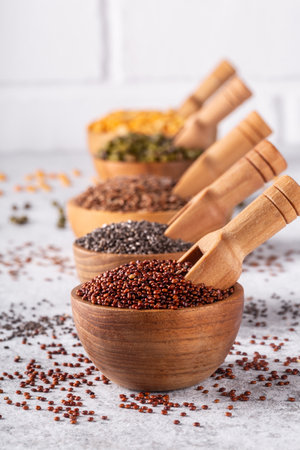 Assortment of beans, seeds, legumes on white concrete background. Source of vegetable protein, eating healthy.の写真素材