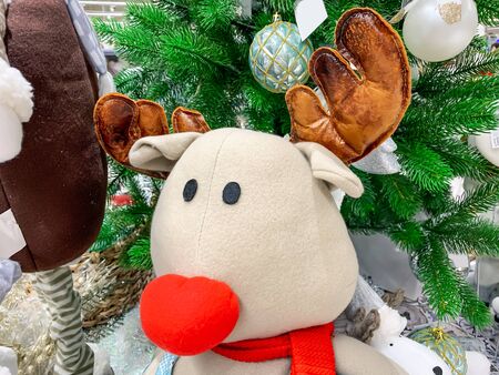 Stuffed toy, teddy moose, deer at christmas market fair in the mall.の写真素材