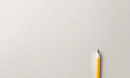 A single yellow pencil lies in isolation on a pure white backdrop, its tip pointing towards an unwritten future. Its a testament to the power of one in the creative journey.の素材