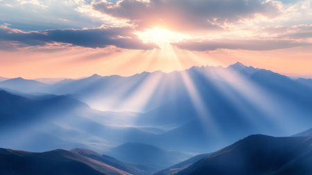 Golden sunset with radiant light over a mountain rangeの素材