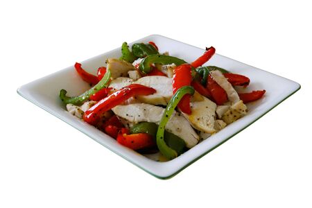Chicken with green and red pepper salad in a square bowl on a white background - easy to isolateの写真素材