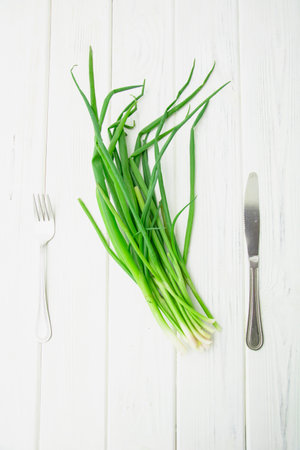 Beautiful juicy fresh fragrant bunch of delicious green onionsの写真素材