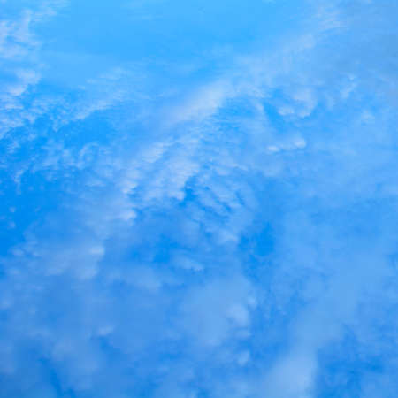 Beautiful aerial sky with big cute romantic blue cloudsの写真素材