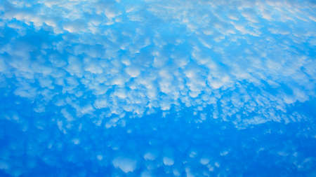 Beautiful aerial sky with big cute romantic blue clouds