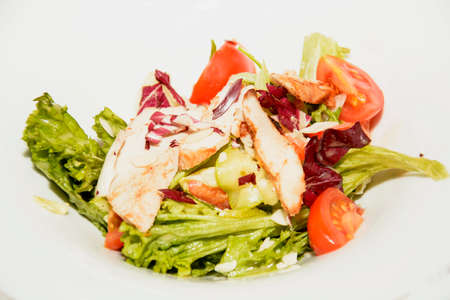 Delicious appetizing restaurant food on tables in platesの写真素材