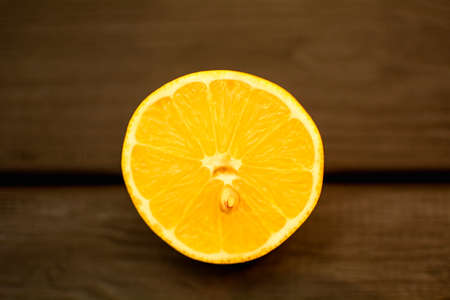Juicy ripe delicious lemon on a light backgroundの写真素材