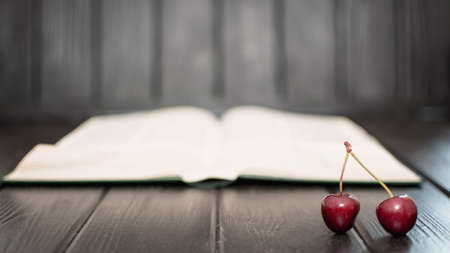 Many ripe cherries on a beautiful background in a plate