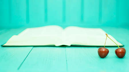 Many ripe cherries on a beautiful background in a plateの写真素材