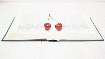 Many ripe cherries on a beautiful background in a plate