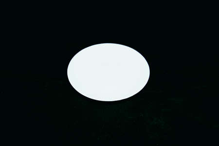 beautiful large flat white plate on colored backgroundの写真素材