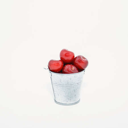 Many ripe cherries on a beautiful background in a plate