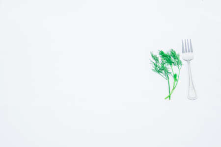 Fresh greens dill on a light background