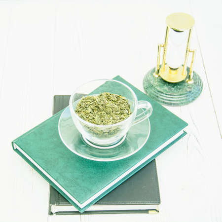 Green tea in a transparent cup on a light backgroundの写真素材