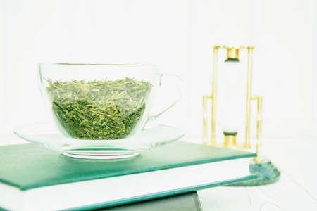 Green tea in a transparent cup on a light backgroundの写真素材