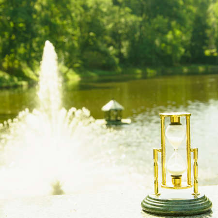 Beautiful hourglass stand against the background of beautiful natureの写真素材