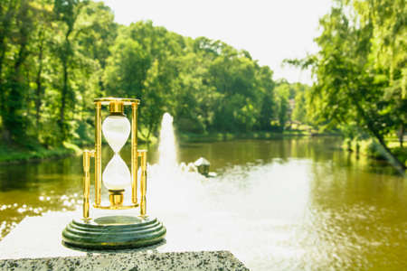 Beautiful hourglass stand against the background of beautiful nature