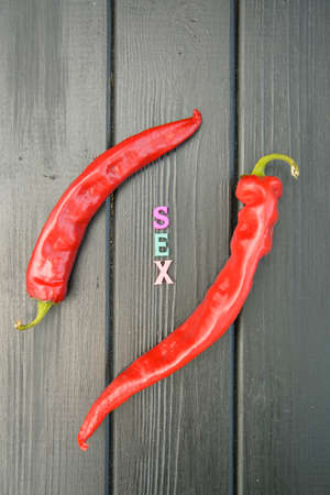 Red hot chilly juicy pepper on a dark background