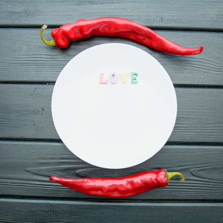 Red hot chilly juicy pepper on a dark backgroundの写真素材