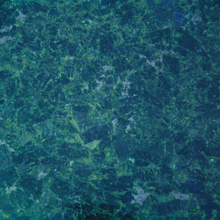 Beautiful iridescent colored large granite stone close up