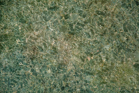 Beautiful iridescent colored large granite stone close up