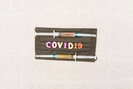 Medical vaccine against coronavirus close-up, covid 19, vaccination, injections, syringes, medical masksの写真素材