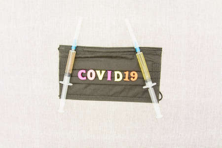 Medical vaccine against coronavirus close-up, covid 19, vaccination, injections, syringes, medical masksの写真素材