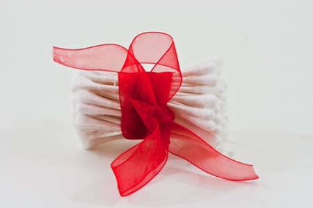 The top of cotton swabs with red bowの写真素材