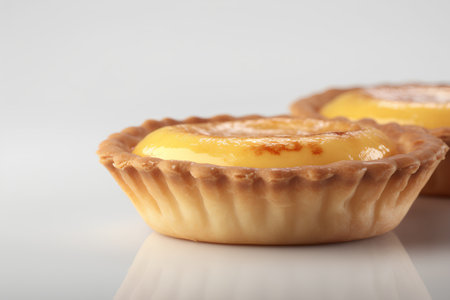 Egg tart on a white background. Selective focus. Toned.の素材