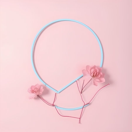 Frame made of pink flowers on a pink background. Minimal style.の素材