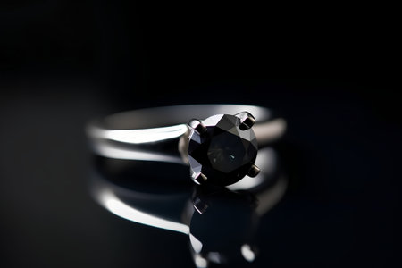 wedding rings on a black background, closeup of photoの素材