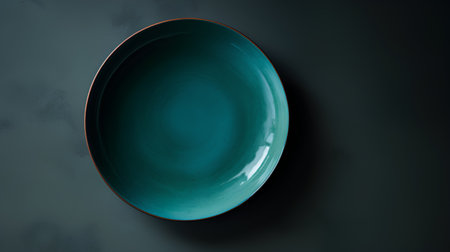 Empty ceramic plate on dark background. Top view. 3d renderingの素材