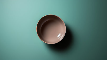 Empty brown ceramic bowl on green background. 3d render illustration.の素材