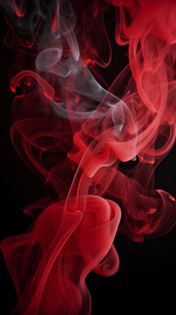 Red smoke on a black background. Abstract background. Design element.の素材