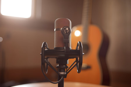 Microphone and guitar in a recording studio. Live music concept.の素材