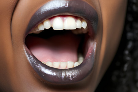 Closeup of beautiful african american woman mouth with teeth.の素材