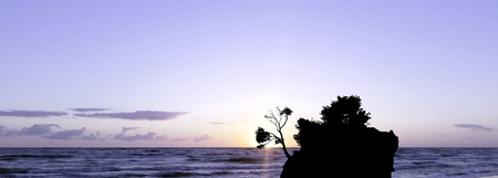 Dramatic sunset over the Adriatic Sea with Kamen Brela - Tiny famous island in Brela, Makarska Riviera, Croatiaの写真素材