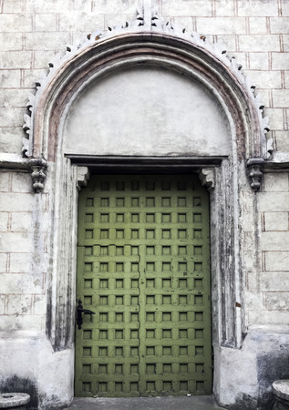 Vintage side entrance in Church of St James the Apostle in Torun, Polandの写真素材