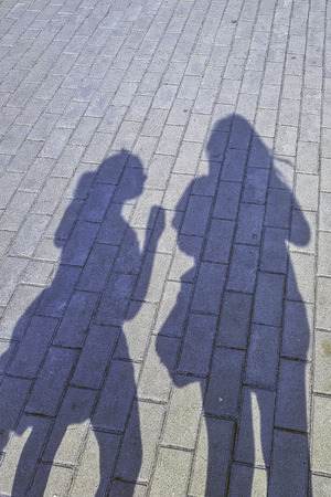Human shadow on the pavement in London, United Kingdomの写真素材
