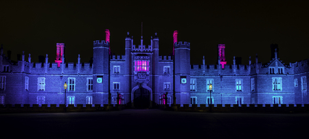 Illuminated Hampton Court Palace by night in Hampton Court, London, United Kingdomのeditorial素材