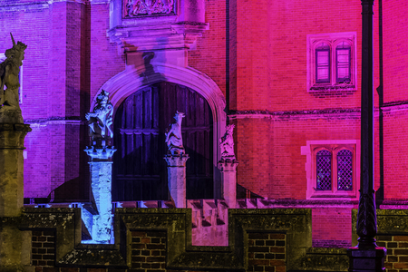 Illuminated Hampton Court Palace by night in Hampton Court, London, United Kingdomのeditorial素材