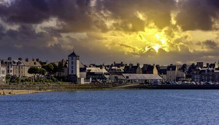 Vintage architecture and beach with dramatic sunrise in background - Saint-Malo, Brittany, Franceの写真素材