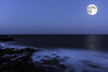 Moon over the ocean - Lanzarote, Canary Islands, Spainの写真素材