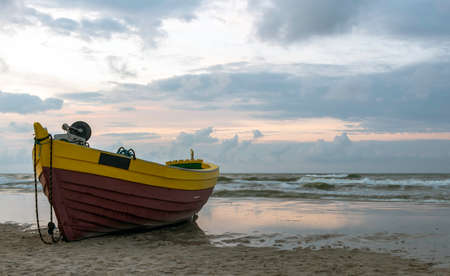 Fishing boat on Polish beach - Debki, Pomerania, Polandの写真素材