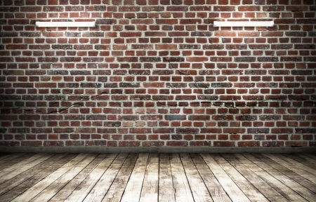 brick wall grunge room background with flourescent lampsの写真素材